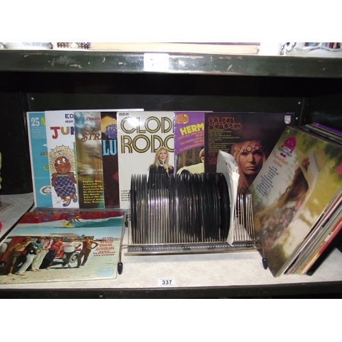 337 - A quantity of vinyl LP's and 45's including Beach Boys etc.