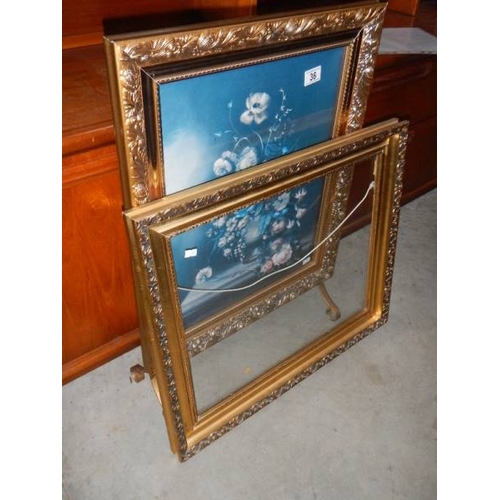 36 - A gilded fire screen and a gilded frame.