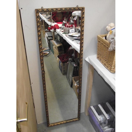 375 - A long gilt edge mirror