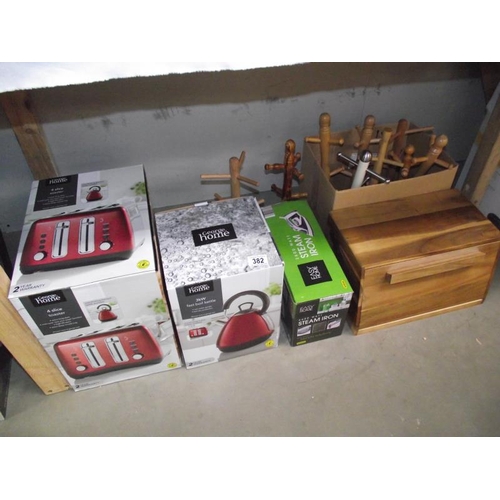 382 - A quantity of new kitchen items including toaster, kettle, iron etc