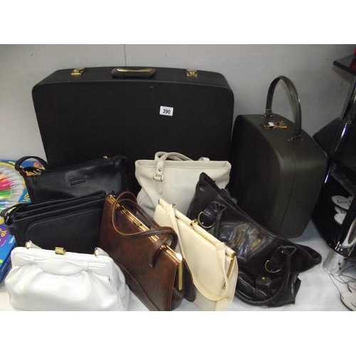 390 - A selection of vintage handbags and suit cases