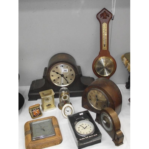 395 - A 1930s oak mantel clock and other closk and barometers