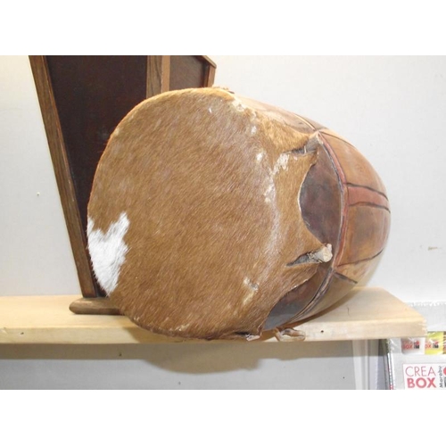 416 - A carved tribal bongo drum and a wooden planter