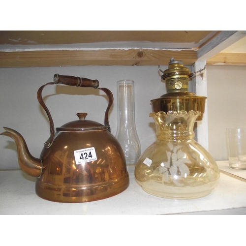 424 - A brass Aladdin no.23 oil lamp and copper kettle