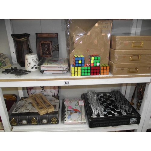 432 - 2 shelves of misc. including chess drinking set, etc.