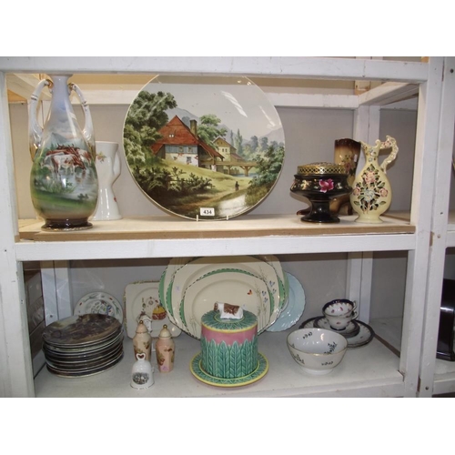 434 - A large continental handpainted charger and other pottery/china including a large cheese keep (2 she... 