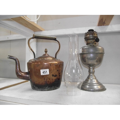 451 - A plated brass oil lamp and a Victorian copper kettle