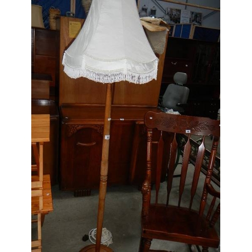 50 - A standard lamp with shade.