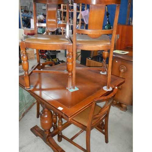 52 - A draw leaf table and 4 chairs.