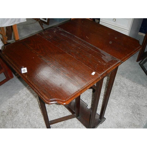 121 - A drop leaf table.