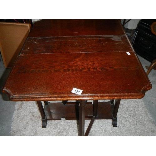 121 - A drop leaf table.