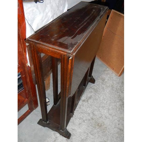 121 - A drop leaf table.