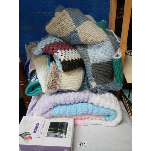 124 - A knitted blanket and other items.