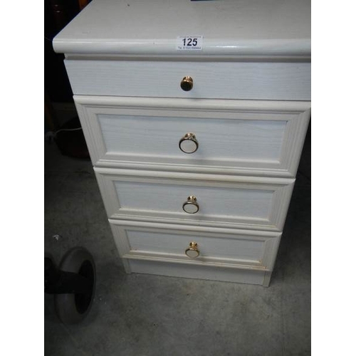 125 - A 4 drawer bedroom chest.