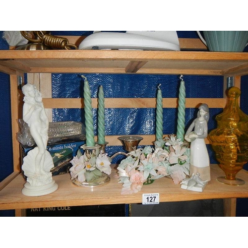 127 - A mixed lot of figures, candlesticks etc.,