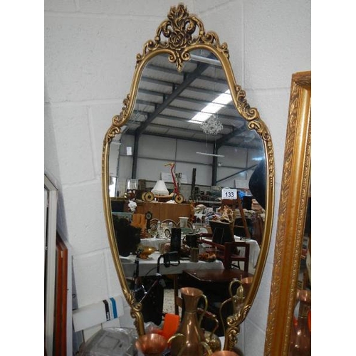 133 - A gilt framed mirror.