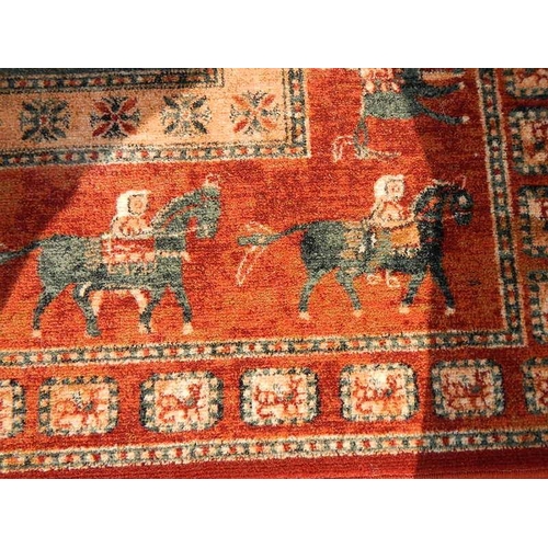 61 - A machine made carpet with men on horses, 300 x 200 cm.