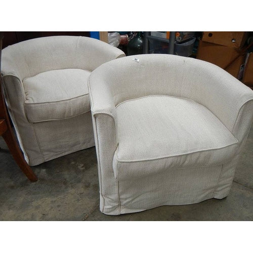 68 - A pair of tub chairs.