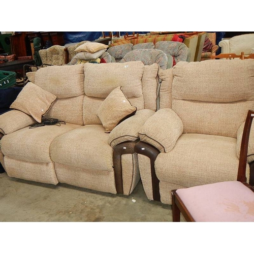 77 - A reclining sofa and matching chair.