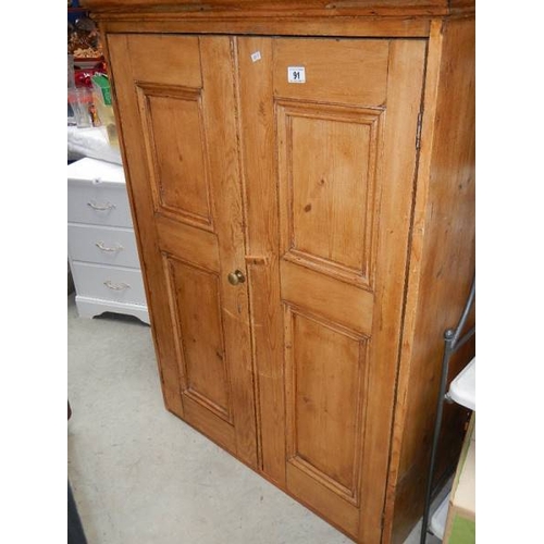 91 - An old pine 2 door cabinet.