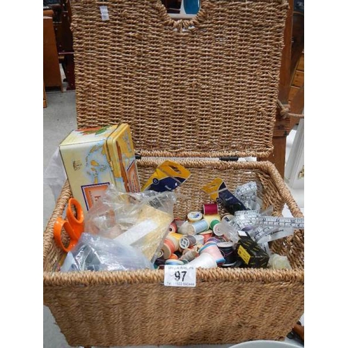 97 - A wicker basket containing sewing items.