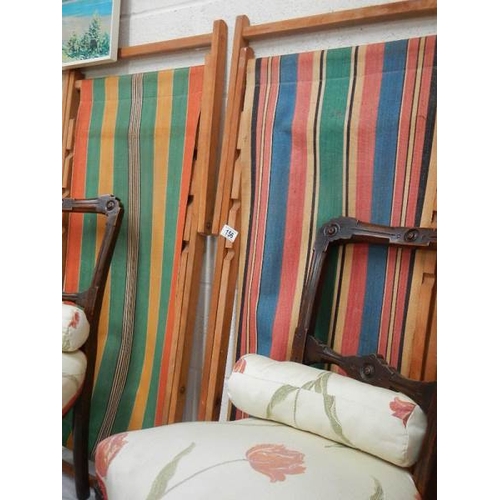 156 - A pair of mid 20th century deck chairs.