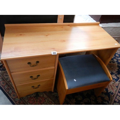 208 - A pine effect desk and stool.