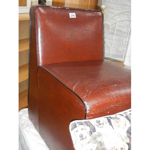 214 - A small leather chair.