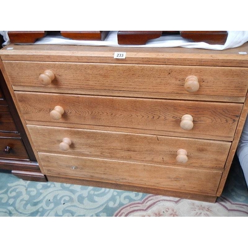 233 - An oak 4 drawer chest.