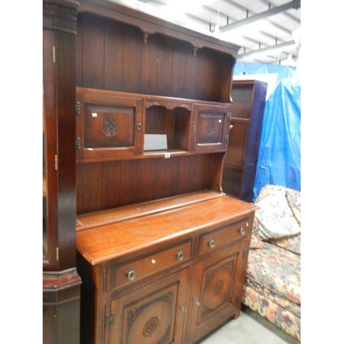 257 - An oak open rack dresser.