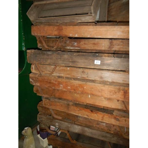 277 - A quantity of old wooden pallets with metal feet.