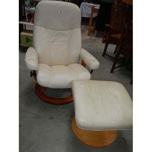 291 - A good cream leather chair with stool.