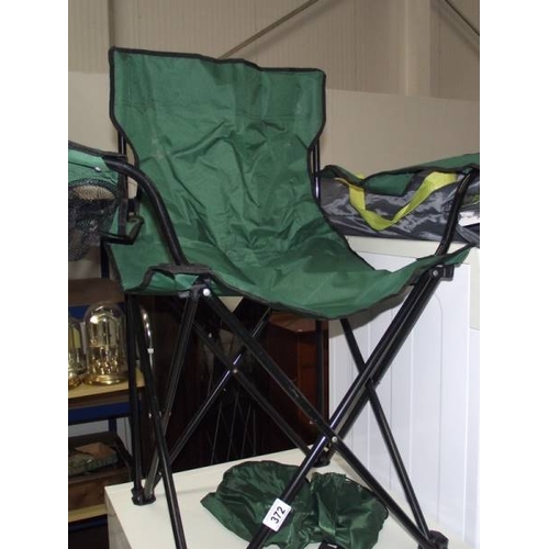 372 - 7 folding camping chairs (5 with covers).