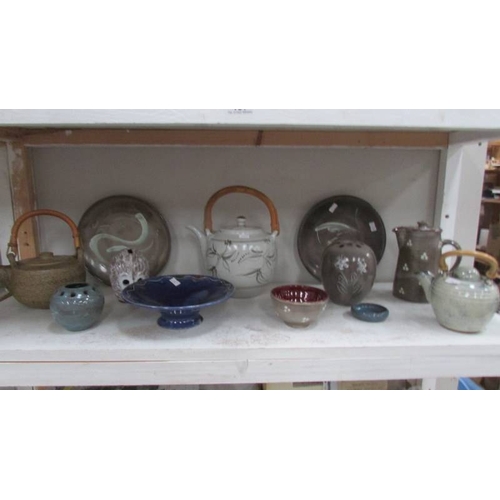 457 - 2 shelves of pottery items including Studio Pottery, vases etc