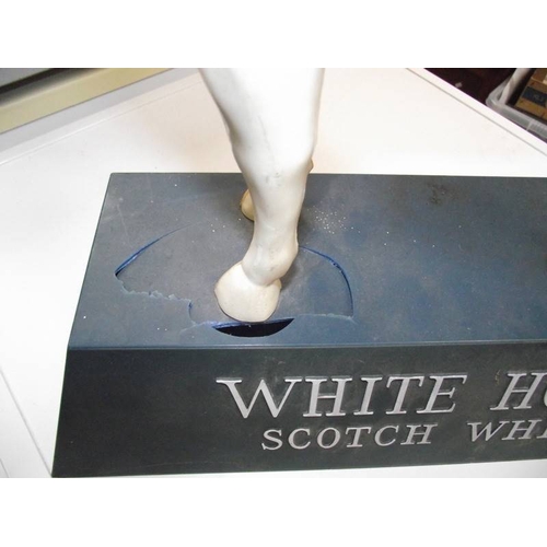 401 - A large plastic White Horse Scotch Whisky  horse a/f and 2 blue pottery horses, 1 a/f.