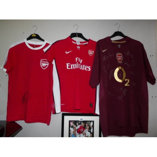 484 - A collection of Arsenal memorabilia including team shirt, signed shirt, A Thierry Henry shirt (as se... 