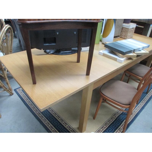 205 - A large extending oak modern dining table