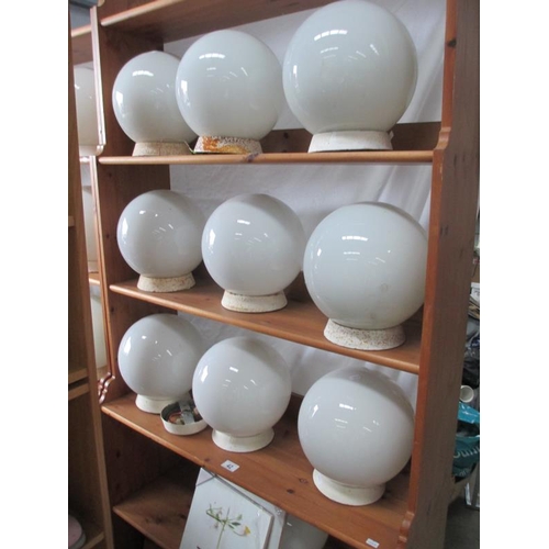 40 - A collection of 19 globe ceiling shades / fitments