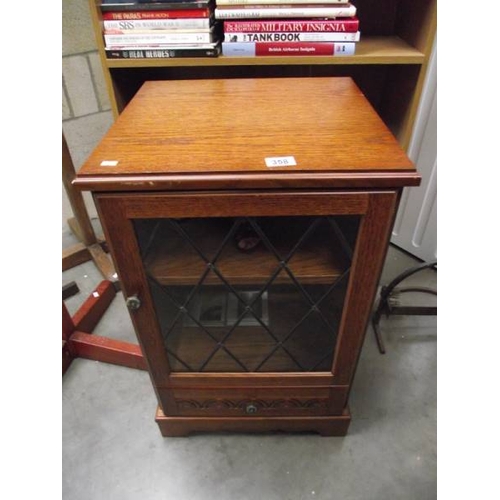 358 - A medium oak cabinet with leaded glass panel (collect only)