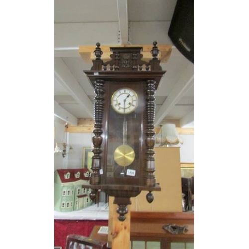 1498 - A mahogany wall clock.