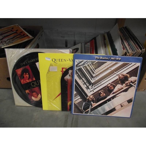 409 - A quantity of LP records including several Queen including 2 picture discs, the Beatles, Pink Floyd ... 