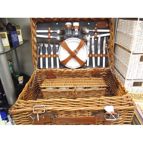 450A - A picnic basket with contents and a 4 drawer wicker chest.