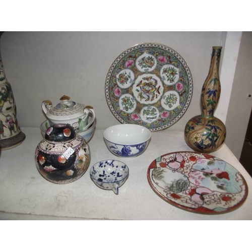 517 - A mixed lot of oriental china including vases, plates etc.,