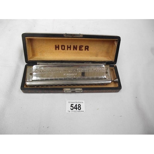 548 - A cased Hohner 64 Chromonica.