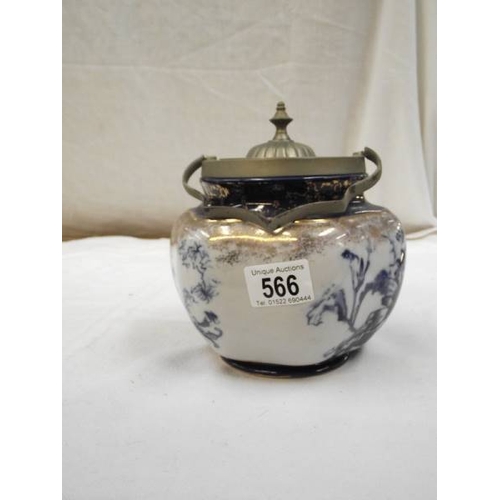 566 - A blue and white Staffordshire pottery biscuit barrel with silver plate fittings.