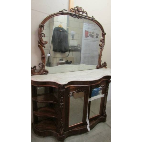 1595 - A Victorian mahogany credenza with marble top and mirror back.