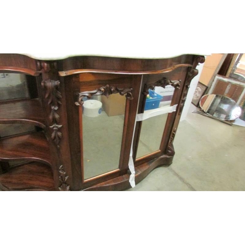 1595 - A Victorian mahogany credenza with marble top and mirror back.