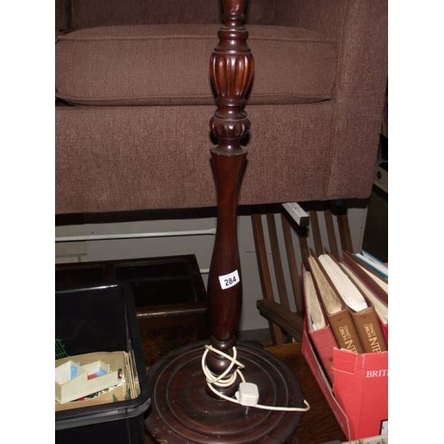 284 - An Edwardian dark wood standard lamp.