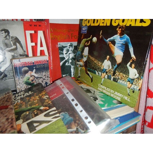 13 - Five shelves of football magazines, hardback and paperback books etc.,