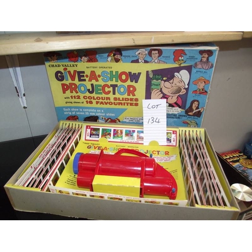 134 - A Chad valley Give-A-Show projector in box complete with slides